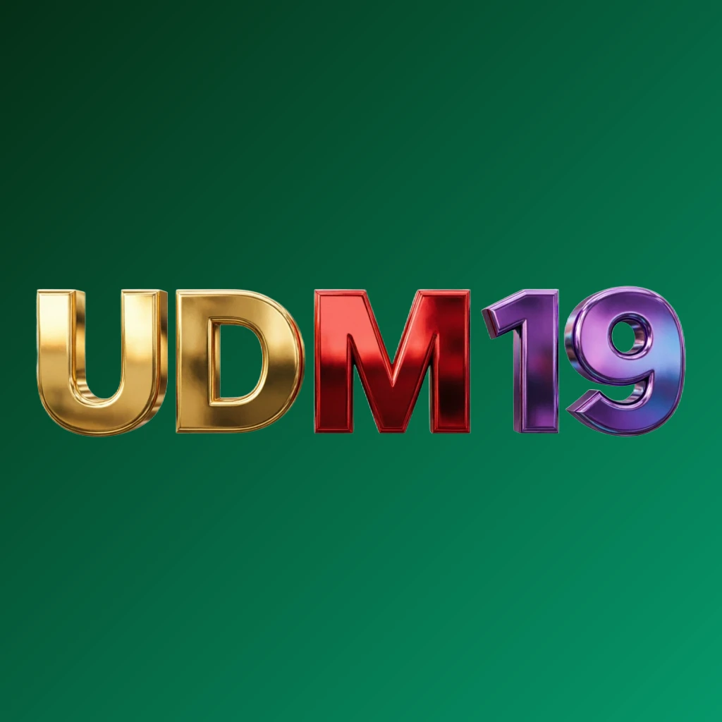 Bright premium UDM 19 logo with thick uppercase typography in vivid gold, red, and purple colors, featuring a polished metallic finish and strong visual impact on a transparent background, designed as a wide horizontal rectangular wordmark for a website header